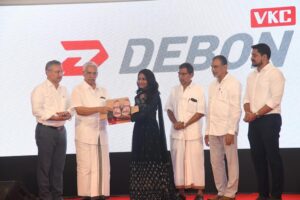 VKC Mammad Koya, Chairman VKC Group launches the brand VKC DEBON by presenting VKC DEBON footwear to popular reality show fame Ms. Aryananda. VKC Group Managing Director VKC Razak, Directors V Rafeeq, Muhammad Kutty, V Muhammad and others are also seen.